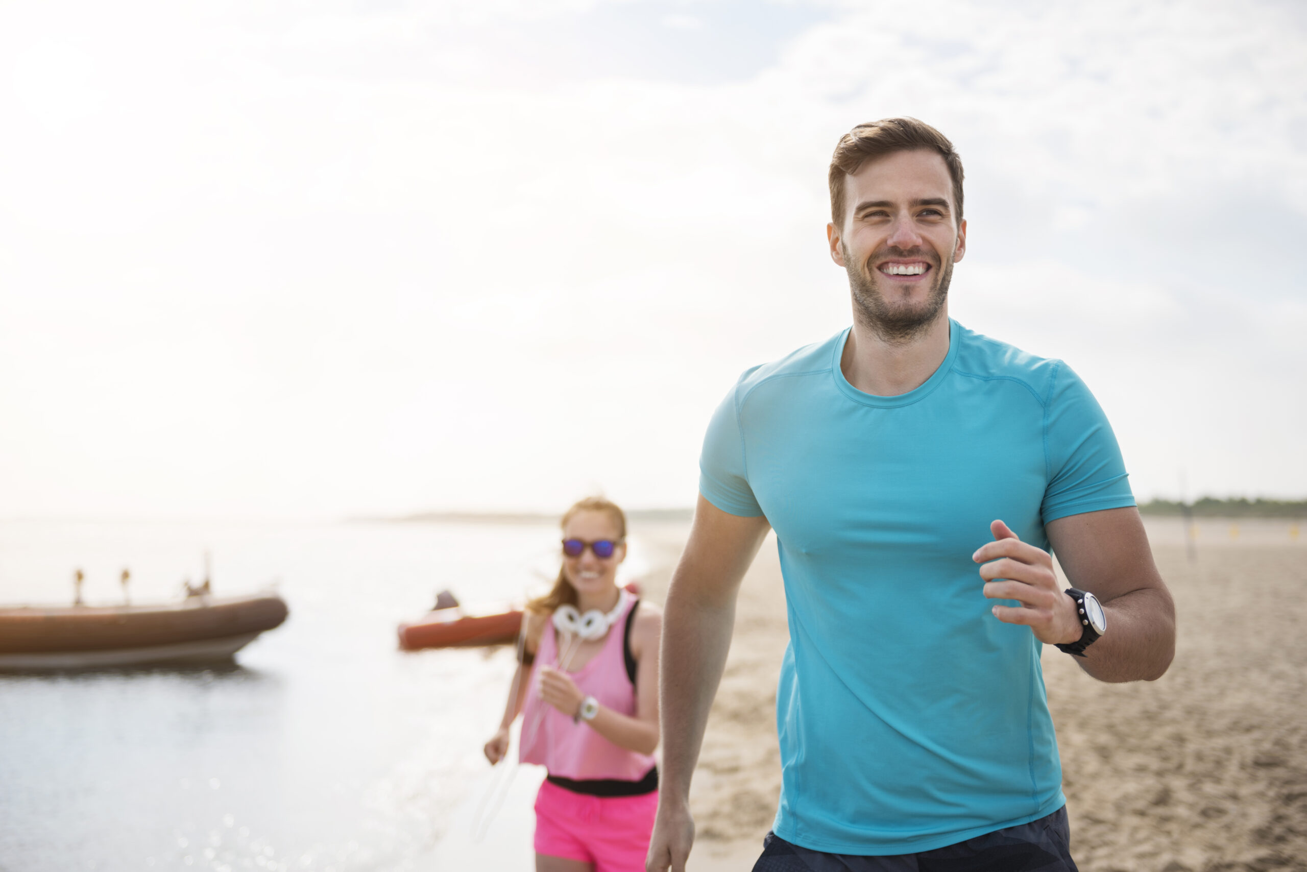 Friends jogging by the sea